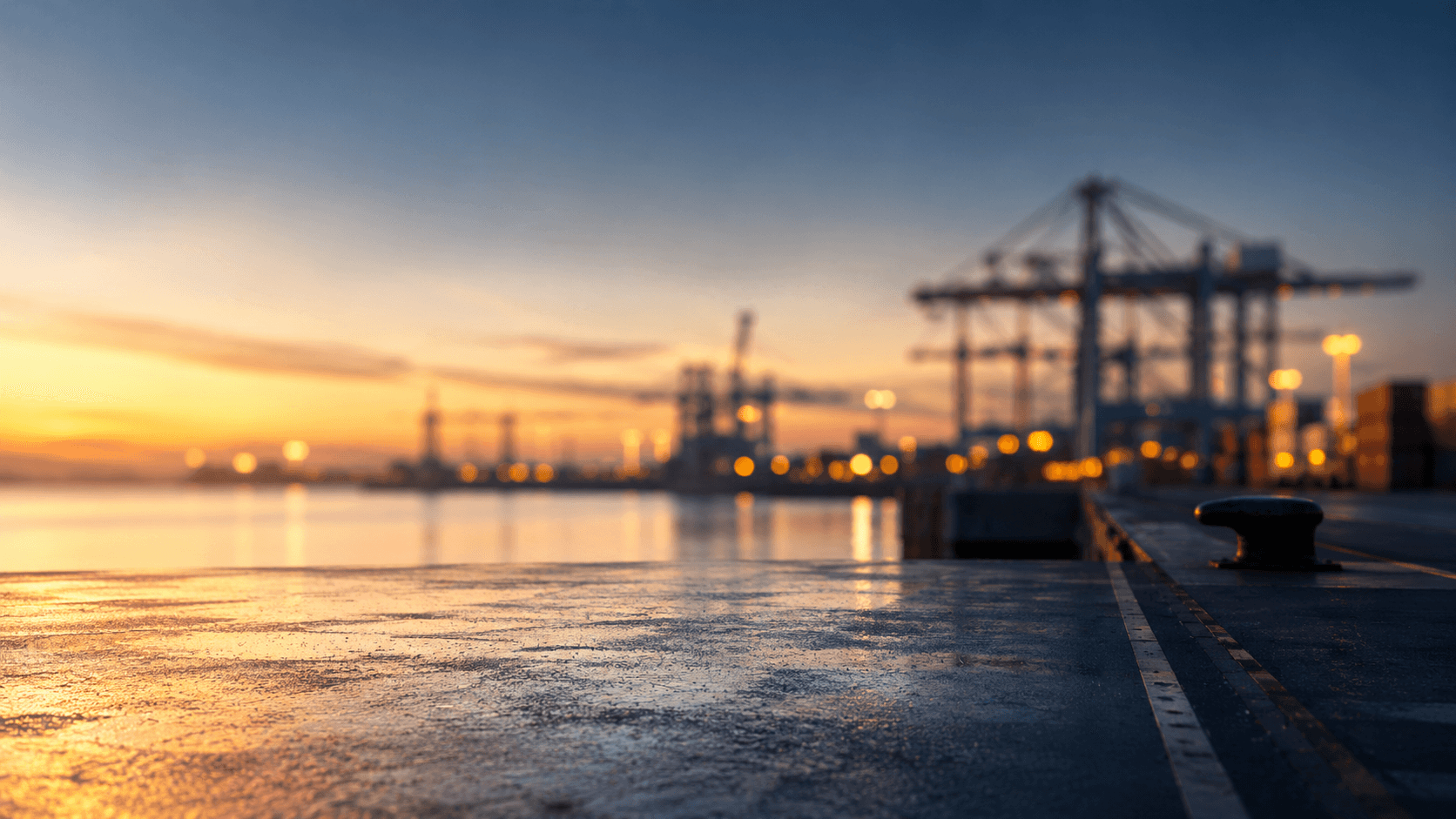 Container ship at a port terminal at sunset